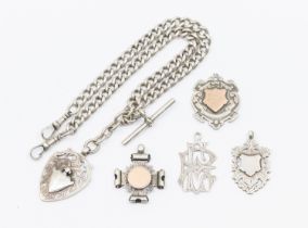 A collection of four silver and one white metal fobs, one upon silver Albert watch chain. Approx.