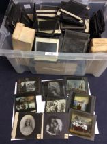 A large collection of various 19th/early 20th Century framed magic lantern negatives/slides;