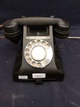 Mid 20th century black Bakelite call exchange dial telephone.