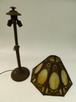 An early 20th century cast metal and glass lamp base and shade, later rewired. (Not tested)