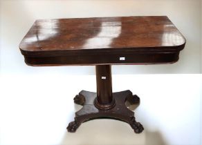 George III mahogany games table on four lions paw feet and castors