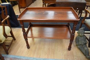 A 19th century mahogany low standing two tier buffet stand, turned supports.