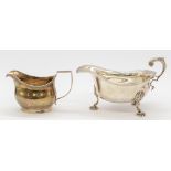 A George III silver helmet shaped cream jug, of simple form with ribbed edging, hallmarked London,
