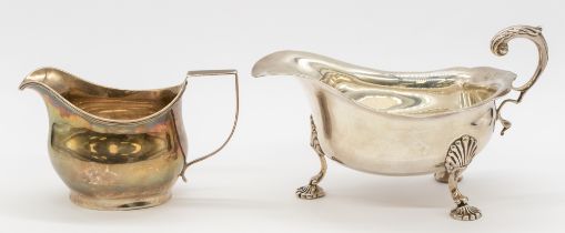 A George III silver helmet shaped cream jug, of simple form with ribbed edging, hallmarked London,