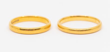 Two 22ct gold bands, width approx 2.7mm, size M1/2, P1/2, weight approx 6.5gms