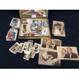 A collection of early 20th century tobacco cards and postcards of film stars, including Laurel and