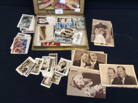 A collection of early 20th century tobacco cards and postcards of film stars, including Laurel and