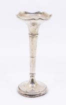 An Edwardian weighted silver trumpet vase, fluted rim and circular footed base. Hallmarked James