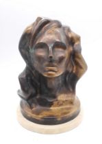 Danie de Jager (1936-2003) - A South African cast bronze head of a woman, upon a circular marble