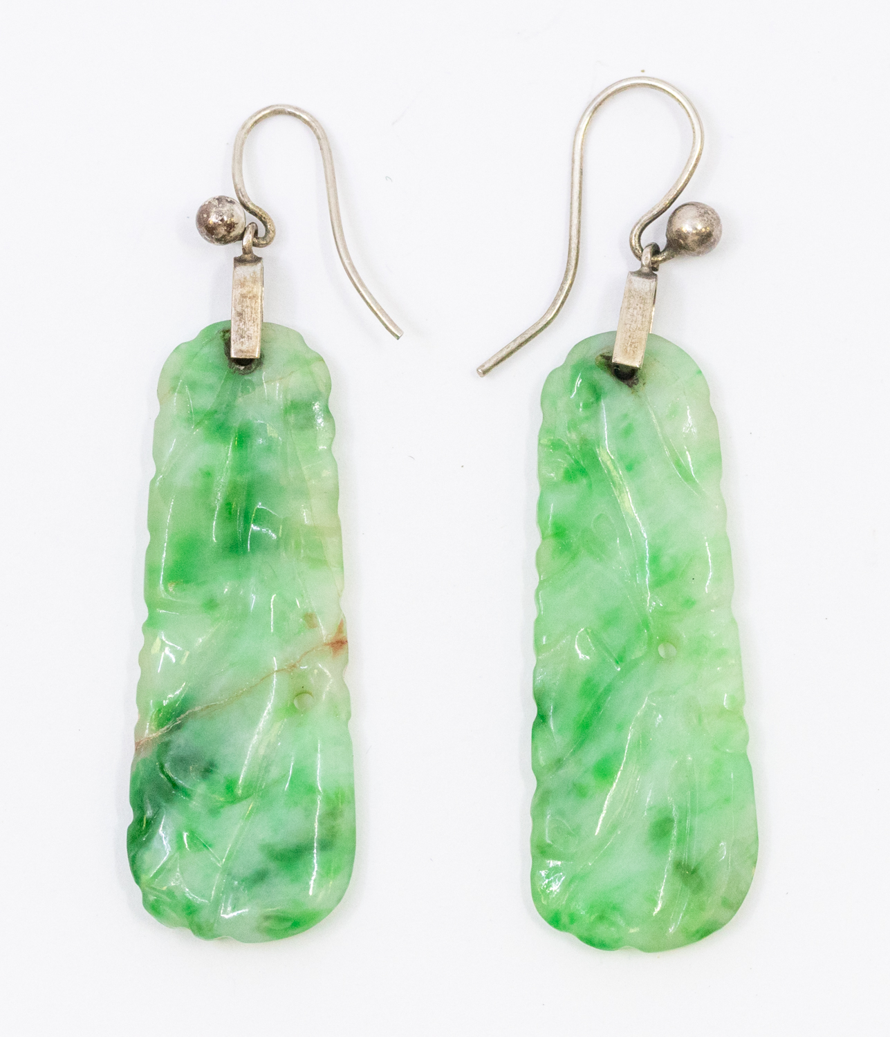 A pair of jade and 9ct white gold crop earrings, comprising a carved jade drop on hook fittings, - Image 2 of 2