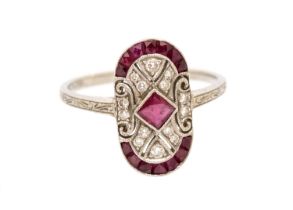 A ruby and diamond platinum Art Deco style ring, comprising an oval setting, the centre set with