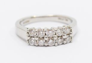 A diamond and platinum dress ring, comprising a double row of round brilliant cut diamonds, total