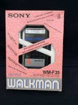 A retro Sony Walkman WM-F31, FM/AM stereo cassette player. In original box