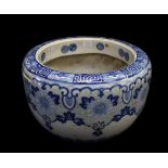 A large Japanese blue & white jardiniere with floral decoration