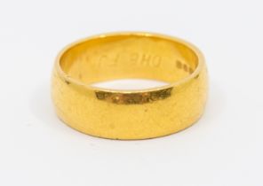 A heavy weight D section 22ct gold band, width approx 7mm, size O1/2, weight approx 10.3gms