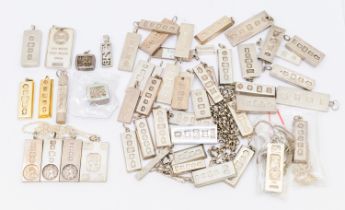 A collection of silver ingots comprising various sizes, assay office marks, including London,