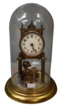 An early 20th century glass domed clock, brass circular based. Unmarked dial, and reg number to