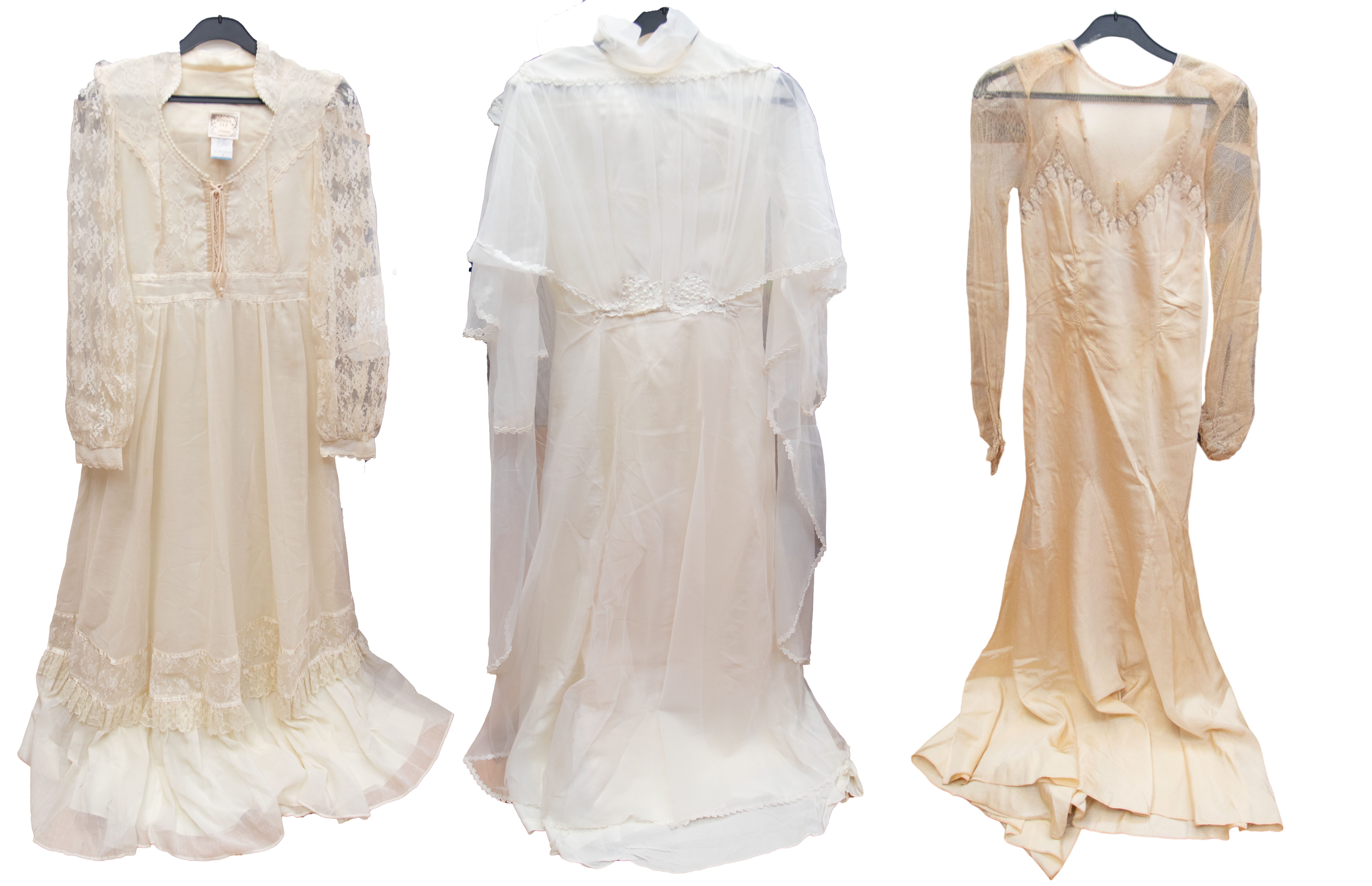 A mid 1930s pale cream taffeta wedding dress with a fitted tulle bodice, round neckline and full