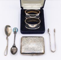 A small collection of silver to include; a George V silver cigarette case, engraved foliage designs,