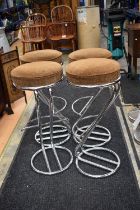 Four 20th century kitchen/bar stools. Chrome frame and padded top.