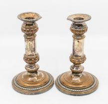 A pair of mid 19th century silver plated candlesticks.