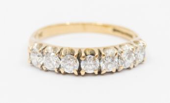 A seven stone diamond and 9ct gold half eternity ring, comprising seven claw set round brilliant cut