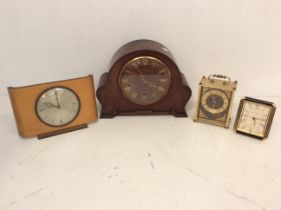 A collection of 20th Century clocks to include; a Metamec teak rectangular form, a Staiger faux
