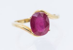 A Madagascar ruby and 9ct gold ring, comprising an oval mixed cut ruby, approx 10 x 18mm, size