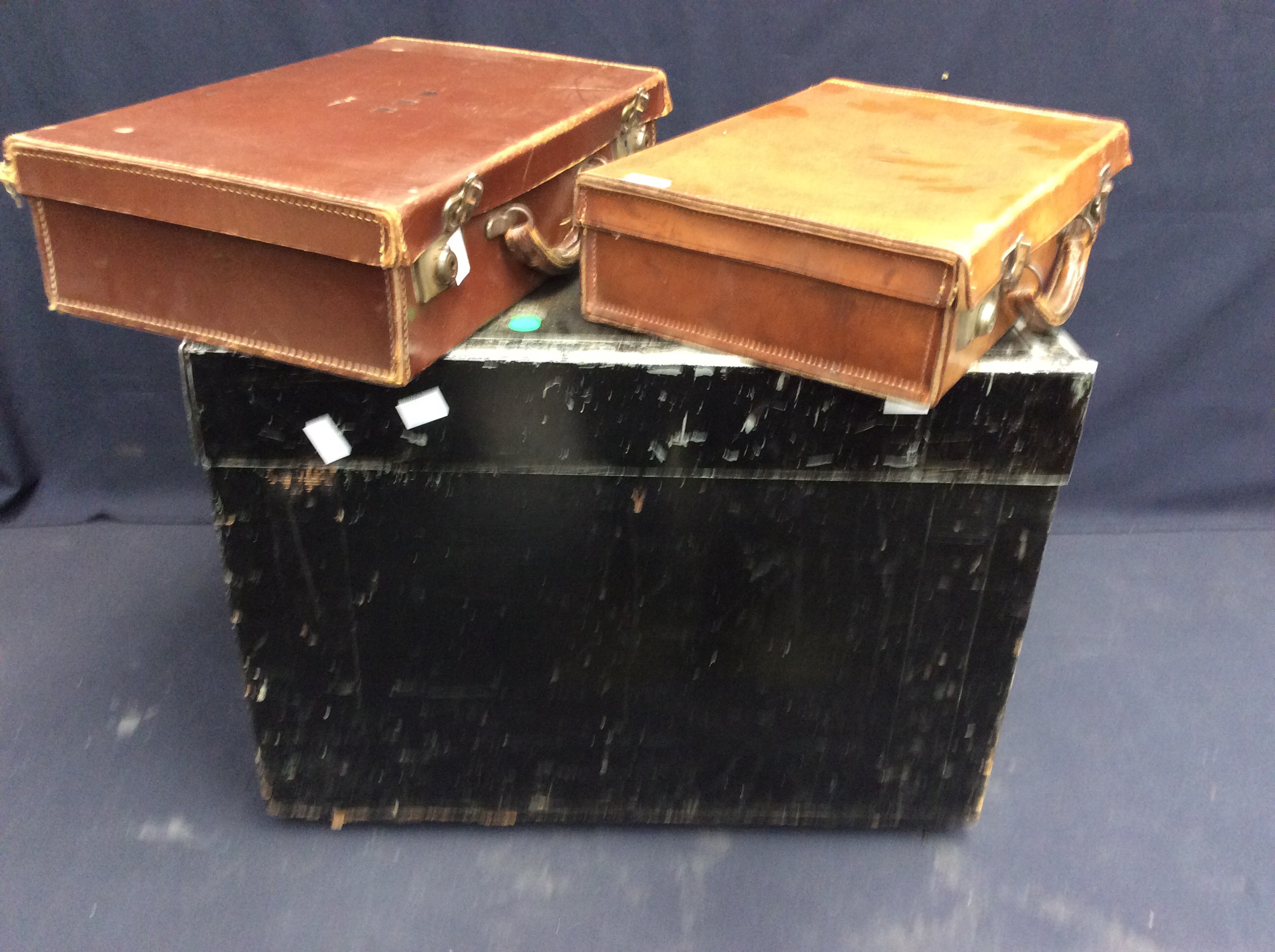 Wood and metal, mid 20th century deed box, together with two small leather cases.