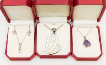 A collection of silver jewellery to include cultured pearl cased pendant and earrings set, amethyst,
