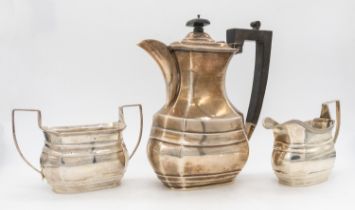 A George VI silver part tea/coffee set consisting of tall coffee pot with ebonised wooden handle and