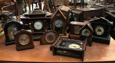 A collection of late 19th and early to mid 20th century mahogany 8-day mantel and wall clocks. (9)