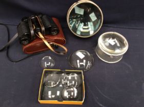 A collection of vintage early 20th century small and large magnifying lenses together with cased