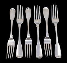 A set of six George IV silver fiddle pattern table forks, the reverse handled engraved with a crest,