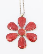 A coral and silver pendant, styled as a large flower, each petal inset with coral, diameter approx