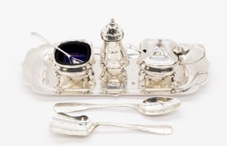 A matched Queen Elizabeth II silver condiment set consisting salt cellar, pepperette, mustard pot