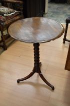 Two mahogany tilt top tripod side tables.