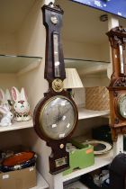 A George III banjo barometer in mahogany by L Frederick of Walsall and Bilston.