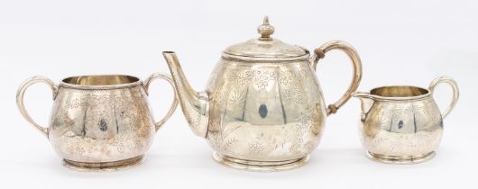 A Victorian Aesthetic silver bachelor tea set consisting of tea pot, twin handled sugar bowl and