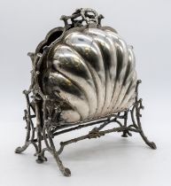 An early 20th Century silver plated clam shell shaped food / bread warmer with twig shaped stand,