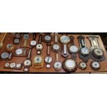 A collection of early to late 20th century barometers in oak and mahogany (1 box)