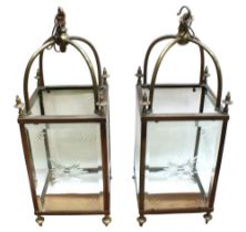 A pair of early to mid 19th Century etched glass and brass cased lanterns, brass finials and hanging