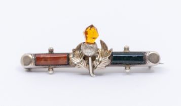 An Edwardian Scottish style silver bar brooch with central thistle decorative section with agate