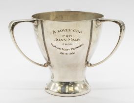 A George V silver tyg/loving cup, with cylindrical body on a spreading foot, and three curved