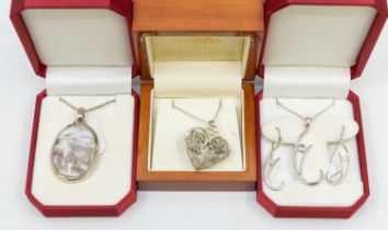 A collection of silver stone set jewellery to include a blue topaz pendant and earrings set, rough