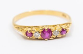 A Victorian ruby and diamond 18ct gold ring, comprising three graduated round mixed cut rubies the