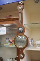 An A. Maspoli of Hull burr walnut cased barometer, with inlayed detail.