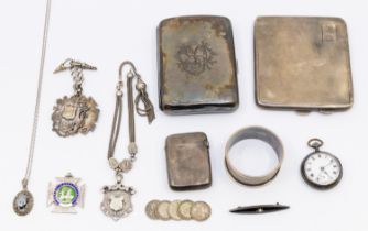 A collection of silver to include a cushion shaped engine turned cigarette case, Birmingham 1937,