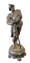 A spelter figure of a 17th century German soldier holding an early rifle