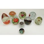 A collection of mixed 20th Century glass paperweights including a Caithness Scotland "Midas" no